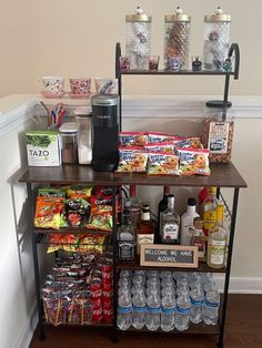 a shelf with drinks and snacks on it