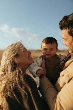 a woman holding a baby in her arms