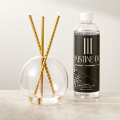 Canada-based Everlasting Candle Co. brings us this elegant steel candle that never melts, providing endless clean-burning ambience. Three everlasting steel oil candles are housed in the glass Neva vase, which gets its name from the Latin word for snow. Includes one bottle of Pristine Oil r, a natural and biodegradable mineral oil that's completely clean burning and used exclusively with Everlasting candlesticks. Each bottle provides 50 hours of smoke-free, scent-free candlelight ambience.  -Glas Everlasting Candle, Gold Taper Candle Holders, Coffee Table Books Decor, Round Glass Vase, Glass Tealight Candle Holders, Gold Candle Sticks, Latin Word, Taper Candle Holder, Glass Cloche