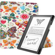 a kindle case with colorful flowers and butterflies on it, sitting next to an ipad