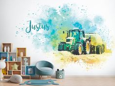 a child's room with a wall mural featuring a tractor and the name jesus