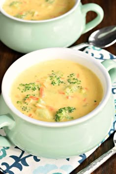 two bowls filled with soup on top of a table