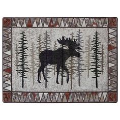 a moose rug with trees and mountains in the background