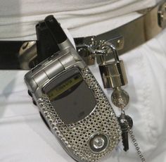 a cell phone is attached to a belt