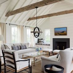 a living room filled with furniture and a fire place