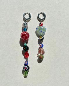 Limited Edition Midnight Sun Collection. Stranded offset vintage murano beads, glass beads with stainless steel hoop (13mm) earrings. The full earring length is 3,5 inches and 3 inches. The colors may vary. Hand-made by Karo at her home studio. Y2k Beaded Earrings, Fun Diy Jewelry, Earings Home Made, Colorful Beaded Earrings, Cute Things To Make With Beads, Beaded Earing Designs, Funky Beaded Earrings, Glass Beaded Earrings, Glass Pearl Jewelry Ideas