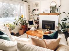 a living room filled with furniture and a fire place