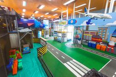 an indoor play area with slides and toys