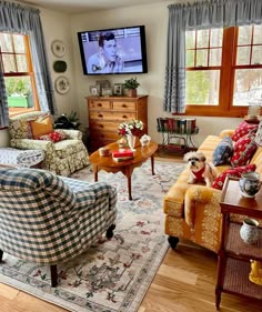 a living room filled with furniture and a flat screen tv