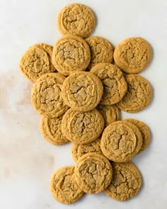 a pile of cookies sitting on top of a white counter