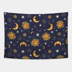 the sun, moon and stars pattern on a dark blue background wall hanging in a bedroom