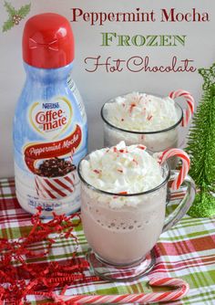 peppermint mocha frozen hot chocolate in two mugs with whipped cream on top