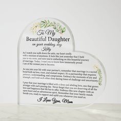 two heart shaped glass plaques with the words to my beautiful daughter on each one side