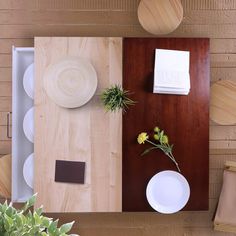 an overhead view of a table with plates, flowers and napkins on the table