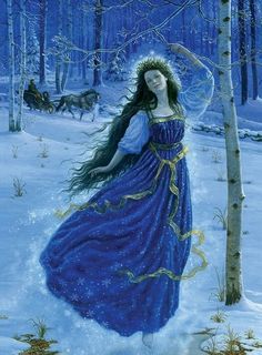 a woman in a blue dress is walking through the snow