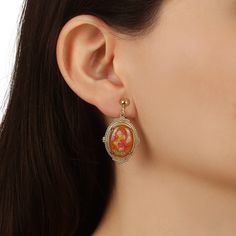 Golden florals are beautifully framed with rich gold tones in these non pierced oval earrings. A classic set of earrings adds ultra-feminine vintage touch. A true classic pair of earrings for any occasion. They make a perfect and affordable gift for a loved one or friend. Available In Orange And Brown Floral Colors Measurements: 1.45" L x 0.78" W Clip On Closure 1928 JEWELRY COLLECTION From the vaults of rich European capitals to the antique laden attics of old American estates, 1928 Jewelry has Cheap Vintage Oval Jewelry, Retro Gold Oval Earrings, Vintage Gold Oval Earrings, Gold Cameo Oval Earrings, Gold Oval Cameo Earrings, Chic Fashionista, Jewelry Classic, 1928 Jewelry, Oval Earrings