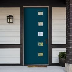 a blue front door with white trim and windows