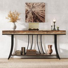 The console table showcases a contemporary design with rustic appeal. It has a dark, metal frame with elegant curves supporting a thick, wooden slab top that has a natural, uneven grain finish. The wood's warm, earthy tones contrast with the sleek black metal. Below the main top, there is a matching wooden lower shelf providing additional storage space. The design balances industrial and natural aesthetics, making it versatile for various decors. Industrial Hallway Table, Industrial Console Table, Extra Long Console Table, Console Table With Storage, Industrial Console, Narrow Sofa Table, Long Sofa Table, Long Console, Long Console Table