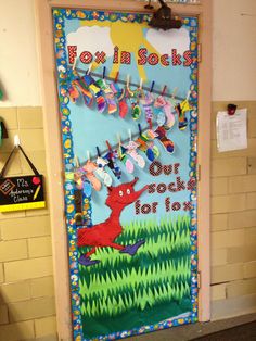 a door decorated to look like a school book with the words how do we rock on it