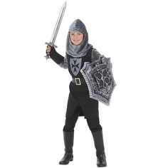 a young boy dressed as a knight holding two swords