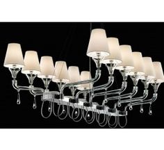 a large chandelier with many lamps hanging from it's sides and white shades