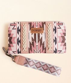 Wrangler® Southwestern Wristlet Wallet - Pink , Women's Dustypink Logo patch pieced canvas wallet Zipper closure Multiple interior compartments Removable wristlet strap Measures 8(L) x 1(W) x 4 1/2(H). Main: PU/Polyester. Lining: Polyester. Apparel & Accessories Western Gift Basket, Cowgirl Stuff, Friend Things, Canvas Wallet, Wallet For Women, Wristlet Wallet, Western Style