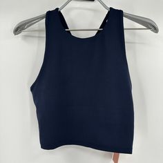 Quince Women's Ultra-Soft Performance Cropped Tank - New With Tags Color: Navy Blue Size: Xs 84% Recycled Polyester, 16% Spandex Quick-Dry Moisture-Wicking Anti-Microbial 4-Way Stretch Measurements 13" Pit-To-Pit, Laying Flat 12.5" Length 13" Waist, Laying Flat Blue Sleeveless Activewear With Seamless Construction, Blue High Stretch Sports Bra, Blue Seamless Tank Top With Medium Support, Blue Tank Top With Seamless Construction And Medium Support, Blue Seamless Crop Top For Yoga, Blue Seamless Yoga Crop Top, Blue Racerback Crop Top For Gym, Blue High Stretch Racerback Sports Bra, Blue High Stretch Sleeveless Top