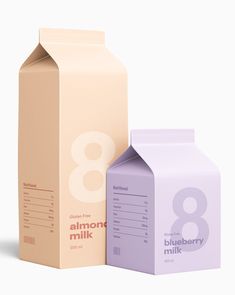 an empty milk carton next to a blueberry milk carton on a white background