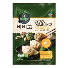 a bag of gyoza dumplings with chopsticks and vegetables in it