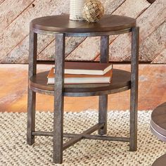 a table with books and a vase on it