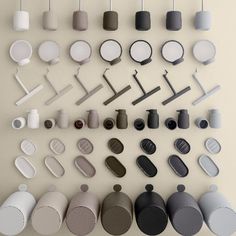 an array of different objects are arranged on the wall, including cups and spoons