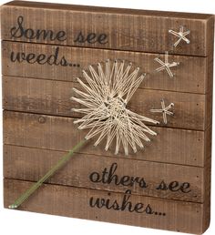 a wooden sign that says some see weeds, others see wishes and stars on it