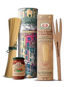 an assortment of pasta, sauce and wooden utensils in front of a box