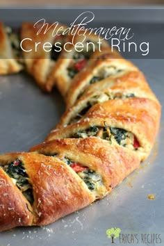 a close up of a pastry on a pan with the words mediterranean crescent crescent ring