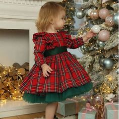 Make your little girl's special occasions even more magical with DreamyVow Red Long Sleeve Christmas Girl Dress J278. This stunning ball gown features long sleeves and is perfect for holiday gatherings or birthday parties. Elevate her style with this elegant and charming dress. Long Sleeve Holiday Dress With Ruffles For Winter, Green Holiday Dress For Winter, Winter Holiday Dress With Ruffles, Plaid Dress For Christmas Holiday, Cute Winter Holiday Dress For Dress-up Occasions, Cute Holiday Dress For Winter, Winter Plaid Ruffled Dresses, White Christmas Dress, Yellow Evening Dresses