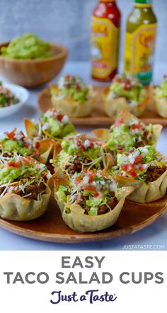 Easy Taco Salad Cups on a wood serving plate with hot sauce and guacamole in the background. Easy Bitesize Appetizers, Teenage Appetizers Parties Food, Mini Foods For Party Bite Size, Taco Salad Cups, Salad Cups, Appetizer Salad, Taco Cups, Mexican Appetizers, Fest Temaer