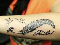 a woman's arm with a feather and the word faith tattooed on her arm