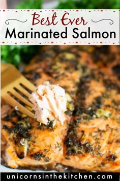 a fork is being used to eat salmon marinade on a plate with parsley