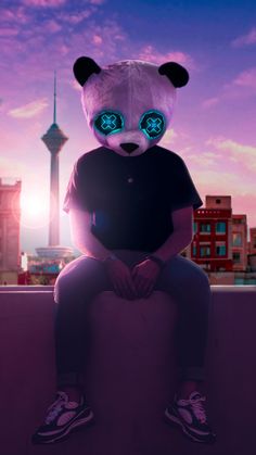 a panda bear sitting on top of a bench in front of a cityscape