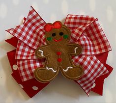 "ADORABLE GINGHAM GINGERBREAD GIRL BOW! **The size of the pictured bow is 5 inches, but can be ordered in other sizes with the same shipping time. Hair bows may be made with a french barrette, an alligator clip (as shown), or a hair tie. ITEM DETAILS: *Ribbon Type: Base Layer- red with white dots Top Layer-red and white gingham Embellished with a pretty embroidered gingerbread girl *BOW DIMENSIONS: 4.5, 5\", or 6\" *CLASP: French Barrette or Alligator Clip *Edges are heat sealed to prevent frayi Bow Christmas, Gingerbread Girl, Christmas Bow, Packaging Gift, French Barrette, Pretty Packaging, Red Gingham, Diy Hair Bows, Red Polka Dot