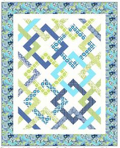 a blue and green quilt with squares on it