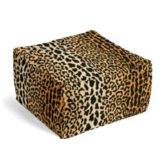 an animal print box sitting on top of a white surface