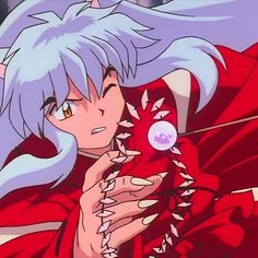 an anime character with white hair holding a red object