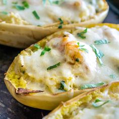 baked potato shells with cheese and herbs on top, ready to be cooked in the oven