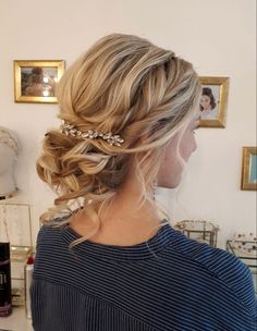 a woman with blonde hair in a braid