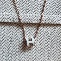 Hermes Mini Pop H Pendant Necklace White | Rose Gold Brand New Hermes Necklace, Hermes Jewelry, Hermes Accessories, Jewelry Lookbook, Necklace White, Mens Accessories Jewelry, Gold Branding, Cute Necklace, Rose Gold Color