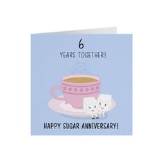 a happy anniversary card with a cup of coffee and two cats on the saucer