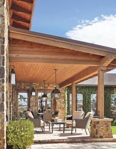 a covered patio with chairs and tables on it