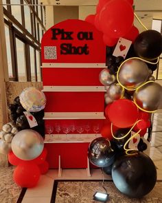 balloons and streamers are on display in front of a sign that says pix ou shot