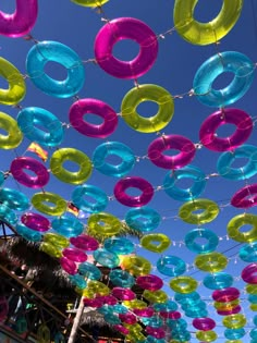 there are many different colored balloons hanging in the air